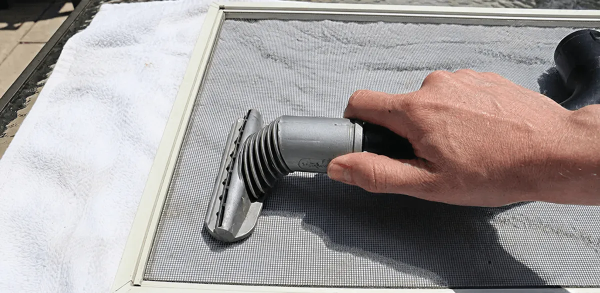 Window screen repair cleaning and fixing a damaged screen mesh in Memphis, TN